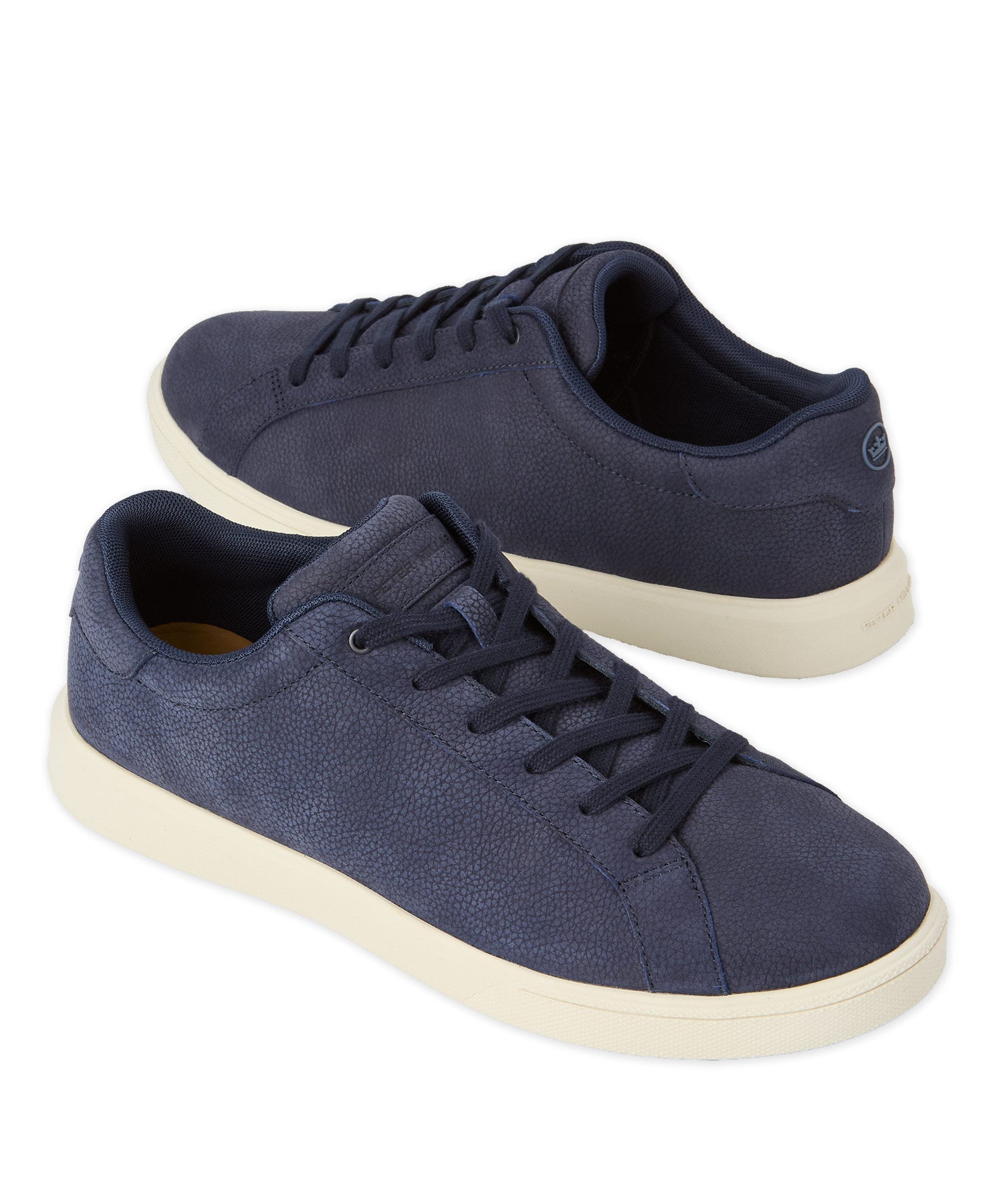 Navy nubuck low-top sneaker, lace-up design with white rubber sole.