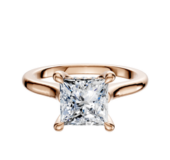 An 18K rose gold engagement ring featuring a cathedral dome design and a square, princess-cut diamond secured in a four-prong hidden halo setting, displayed against a plain white background.