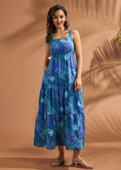 Full-length view of blue tiered maxi dress with tropical abstract print