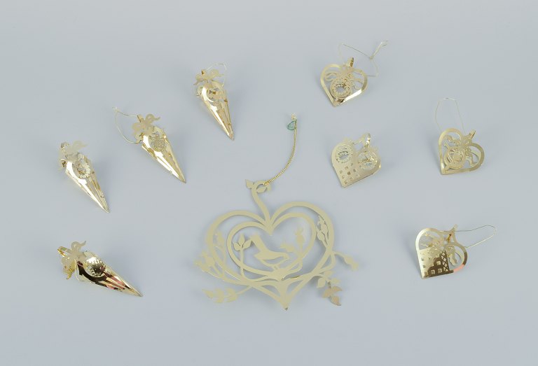 Royal Copenhagen "Royal Christmas". Set of nine brass Christmas ornaments for hanging on the Christmas tree and in the window.