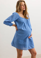Blue maternity mini dress with puff sleeves and a square neckline, designed for nursing.