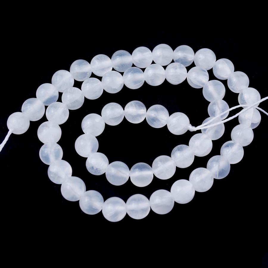 This is a Dakota Stones 6mm Selenite Gemstone strand with A grade round beads in 15-16 inch strand.