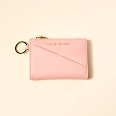 blush colored luxe pocket wallet on a beige background